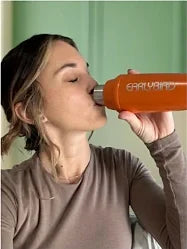 Customer drinking from an orange EarlyBird shaker